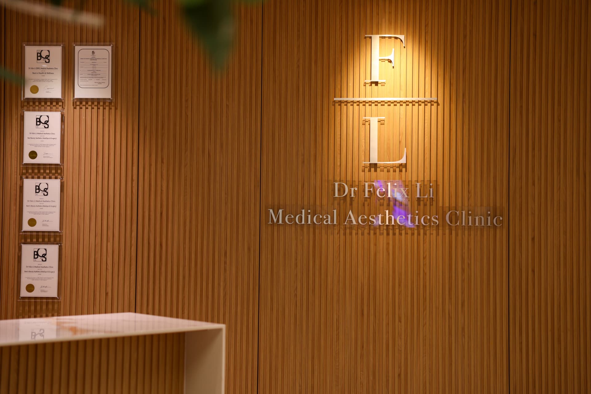 Dr Felix Li Medical Aesthetics Clinic signage and awards wall